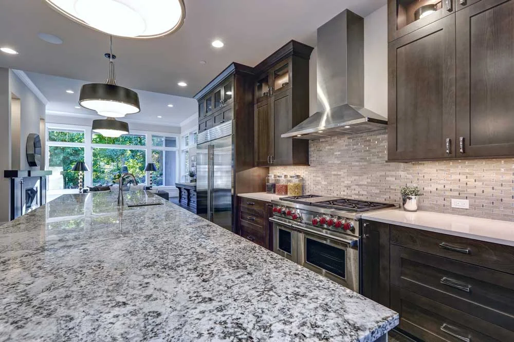 Bookmatched exotic granite kitchen island countertop with straight polished edge installed in Draper, Utah