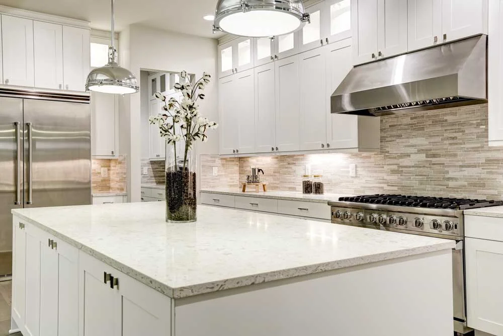 Custom honed Carrara marble and quartz kitchen island countertop with mitered edge installed in Salt Lake County, Utah